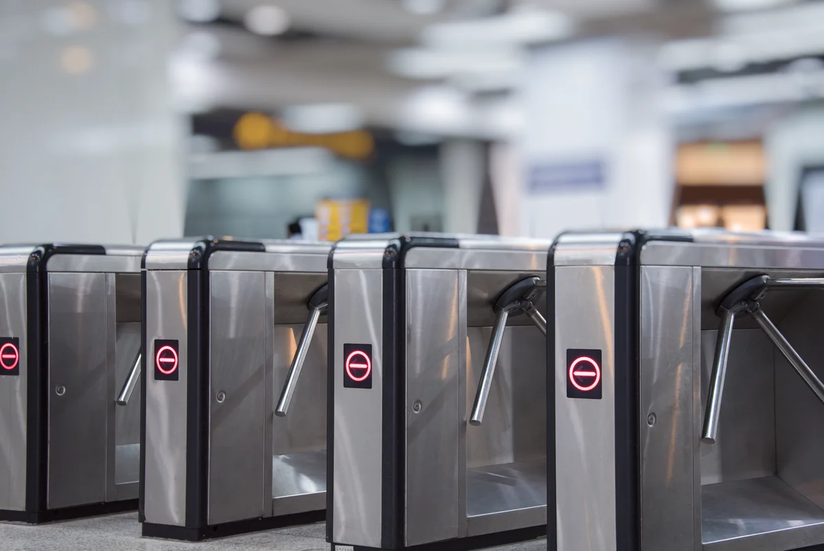 Commercial access control turnstiles in a secured entry point