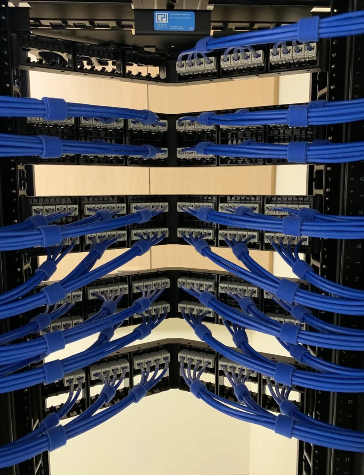 Back of a network rack with organized cable management