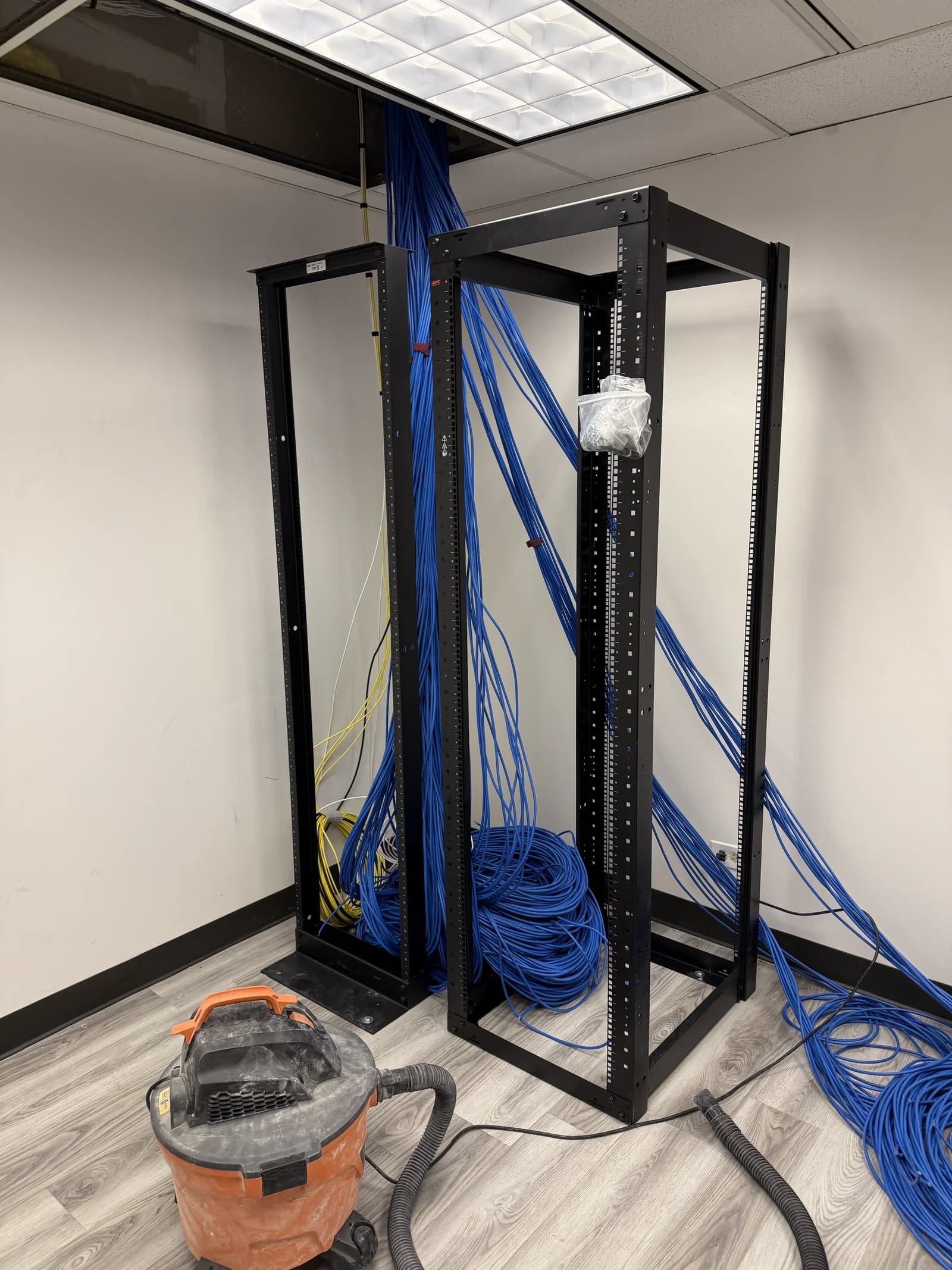 Technician pulling structured cabling during installation