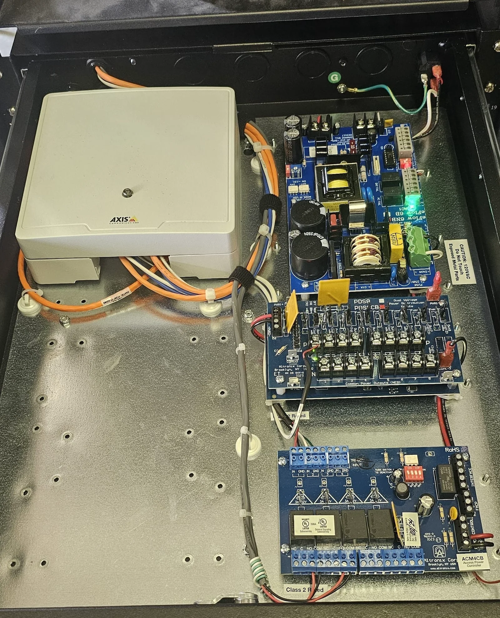 Axis door controller and Altronix power modules in a rack-mounted cabinet